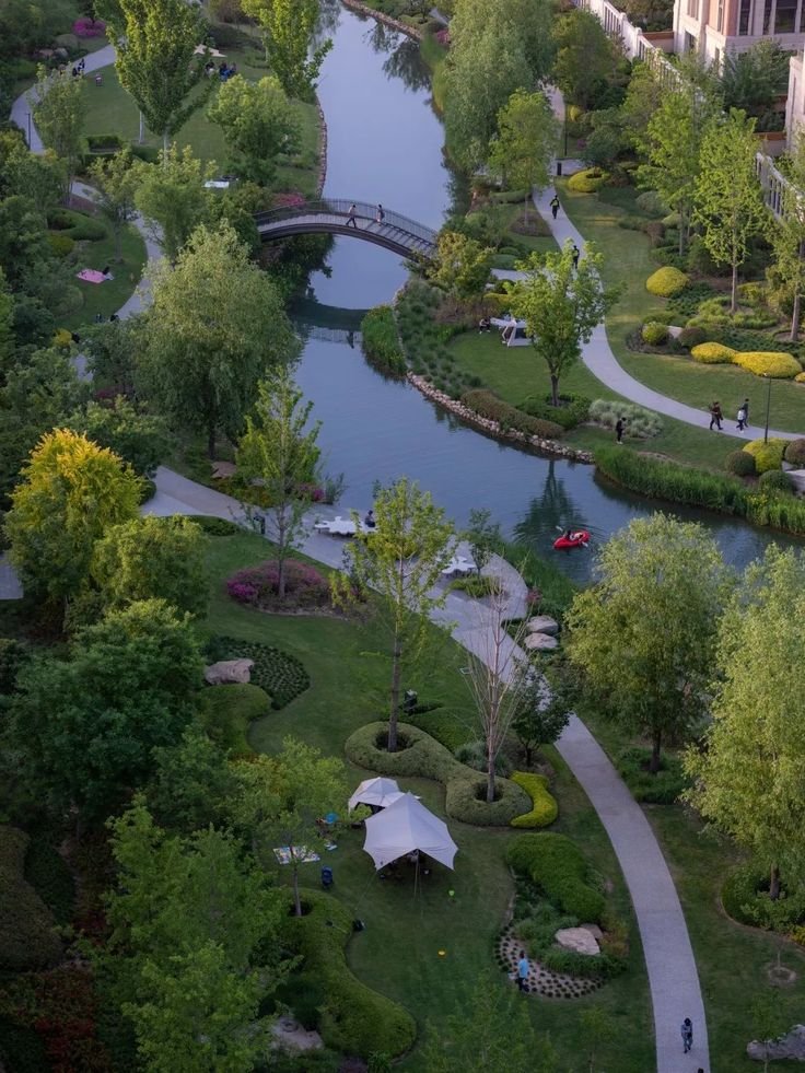 This may contain: an aerial view of a park and river