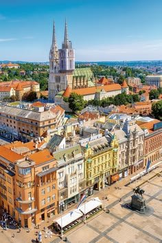 This may contain: an aerial view of a city with tall buildings