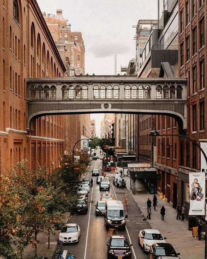 This may contain: an overhead view of a city street with cars and people walking on the side walk