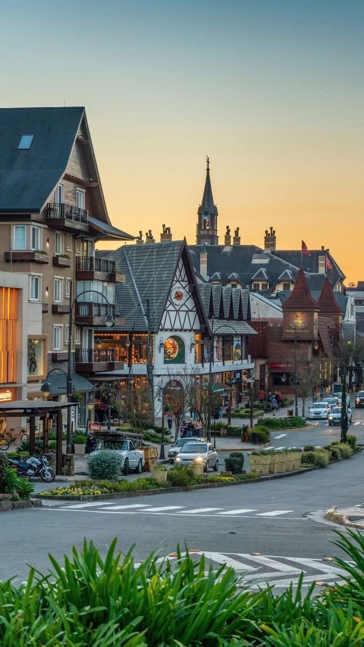 This may contain: a street with many buildings and cars on it