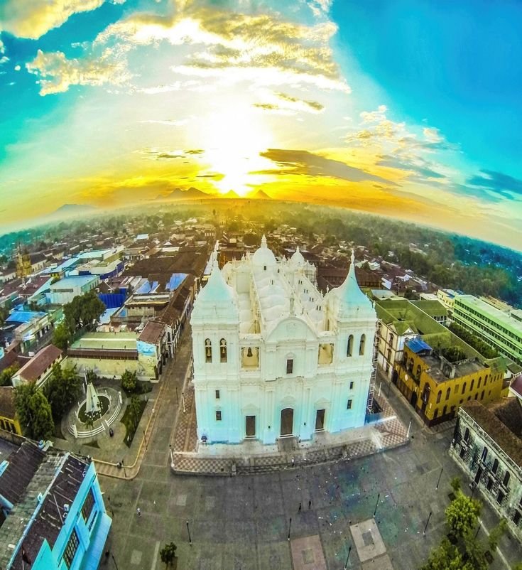 This may contain: an aerial view of a large white church
