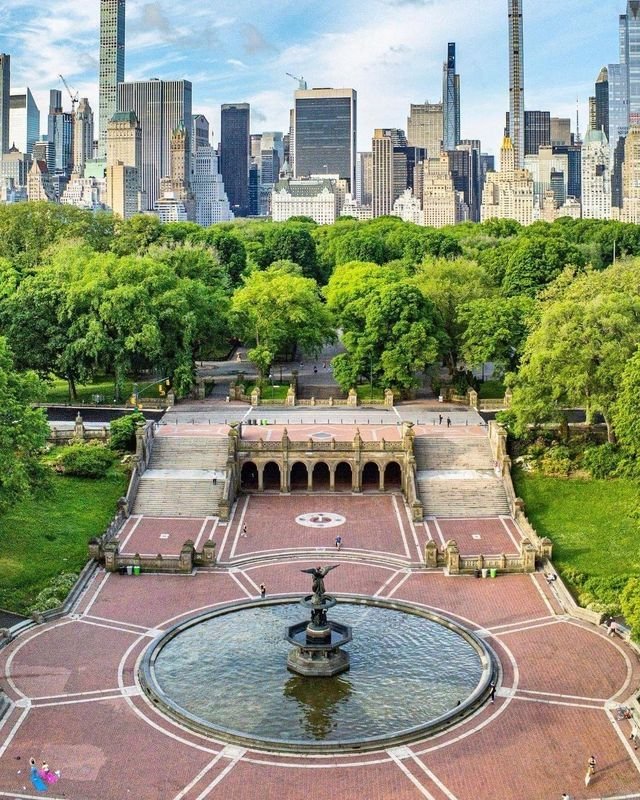 This may contain: an aerial view of the central park in new york city, with skyscrapers in the background