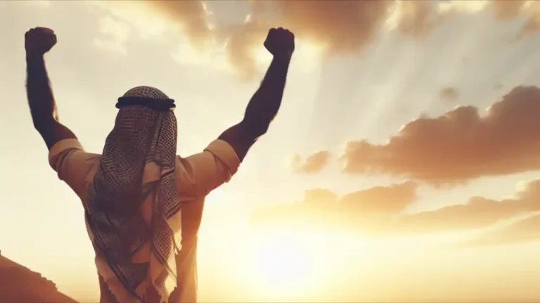 A person rising from a crouched position, arms outstretched triumphantly, silhouetted against a vibrant sunrise backdrop, symbolizing resilience and new beginnings for National Get Up Day