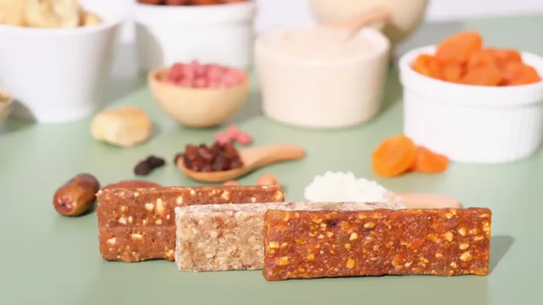 Homemade energy bars with nuts and dried fruits for National Raisin and Spice Bar Day.