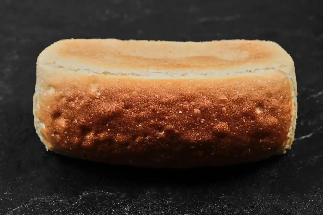 Square loaf of bread on dark background for National Twinkie Day