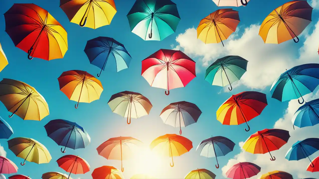 Colorful umbrellas displayed against a bright blue sky, celebrating National Umbrella Day