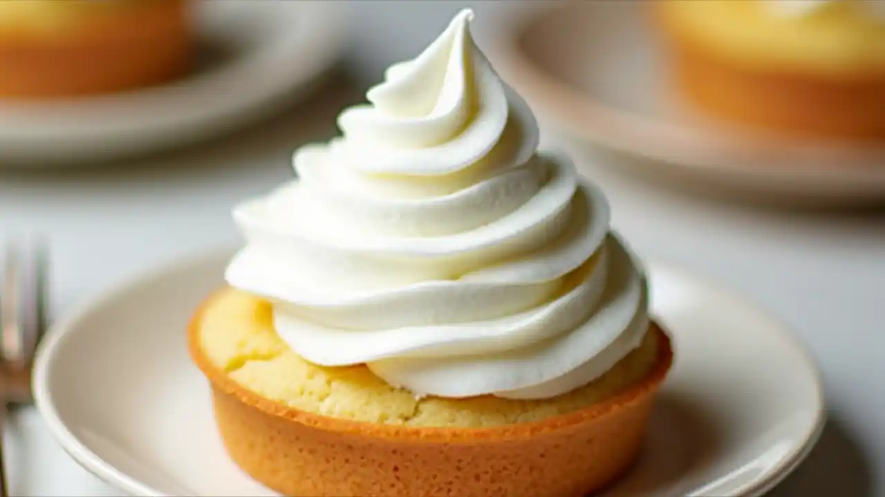 Delicious whipped cream topping on a dessert, celebrating National Whipped Cream Day