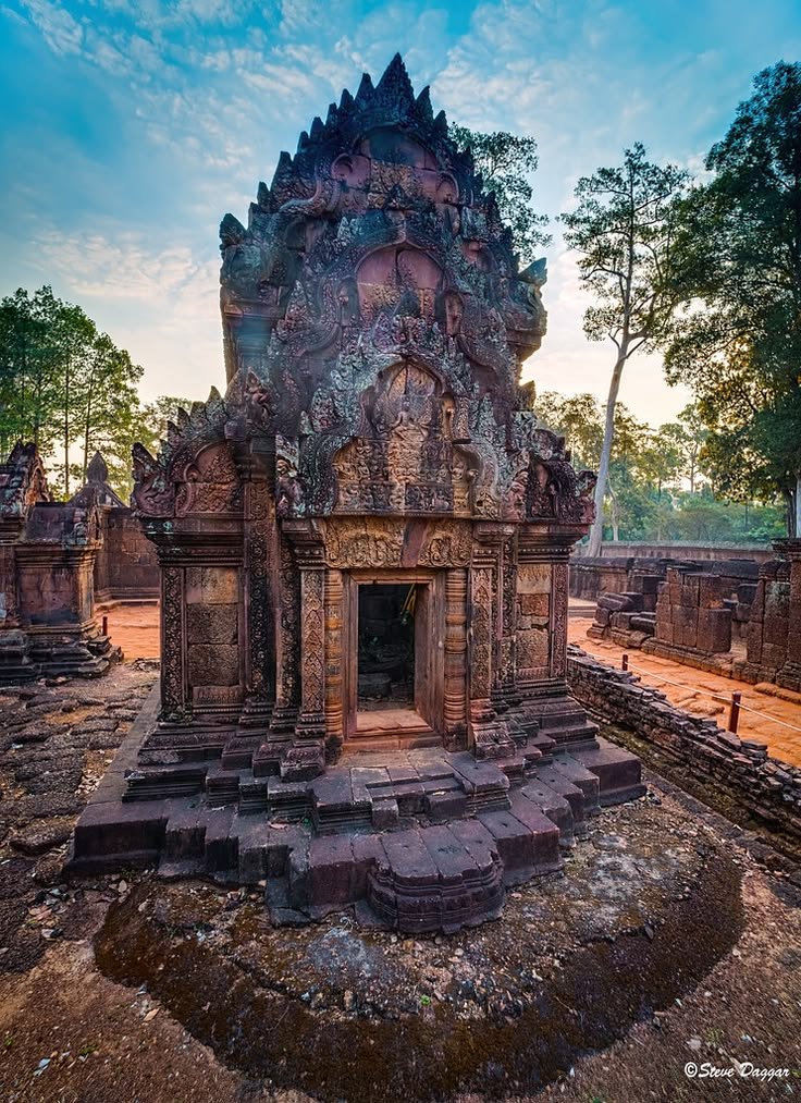 This may contain: an ancient temple in the middle of a jungle