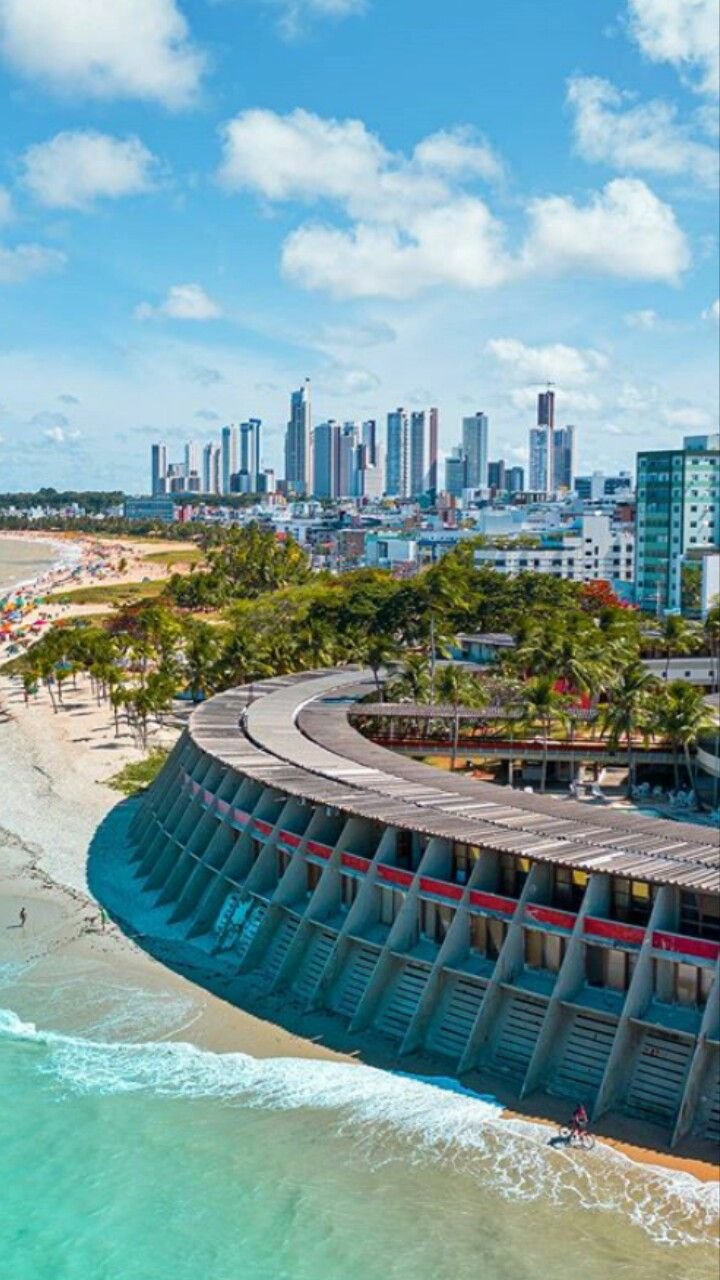 This may contain: an aerial view of a city and the ocean