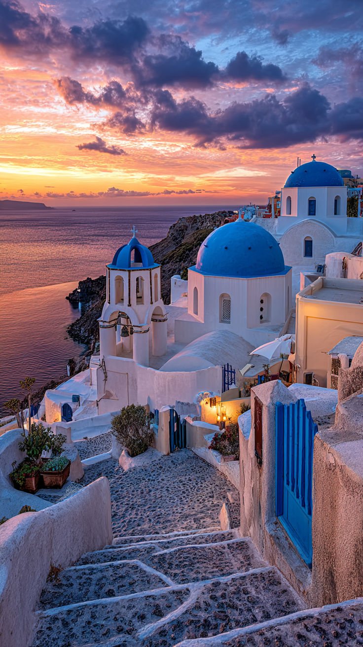 This may contain: the sun is setting over an island with white buildings and blue domes on it's sides