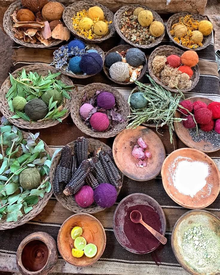 This may contain: bowls filled with different types of food on top of a wooden table covered in leaves