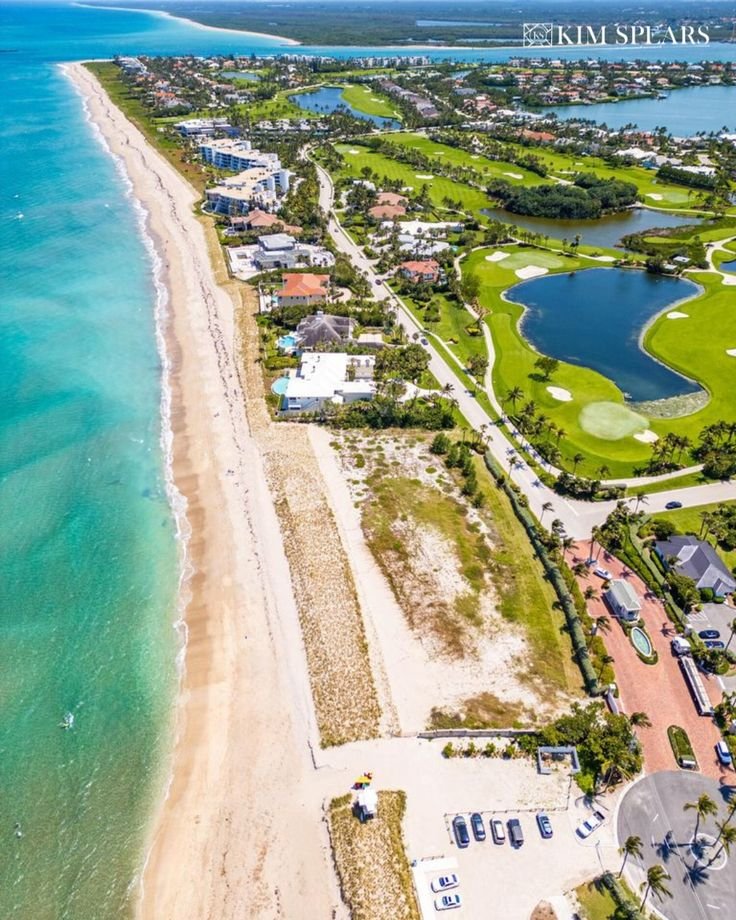 This may contain: an aerial view of the beach and golf course at ocean shores in fort pierce, florida