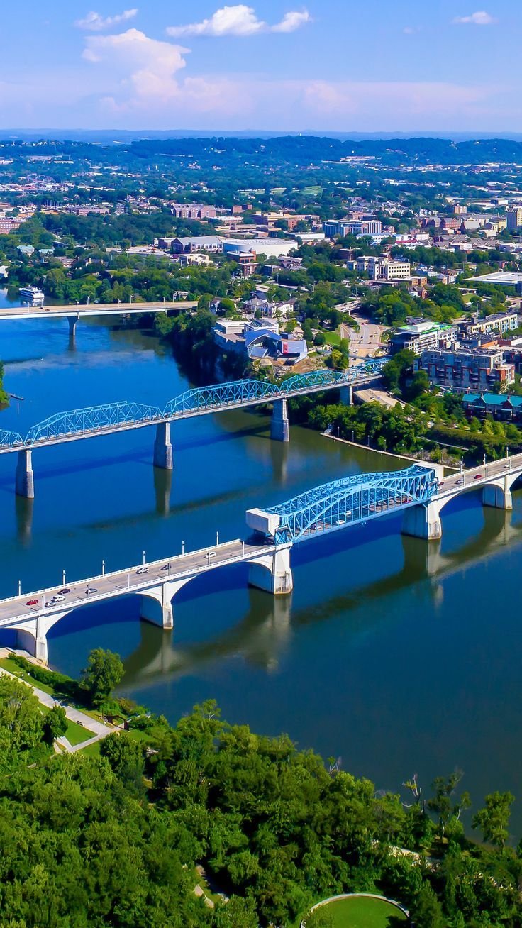 This may contain: an aerial view of a bridge over a body of water