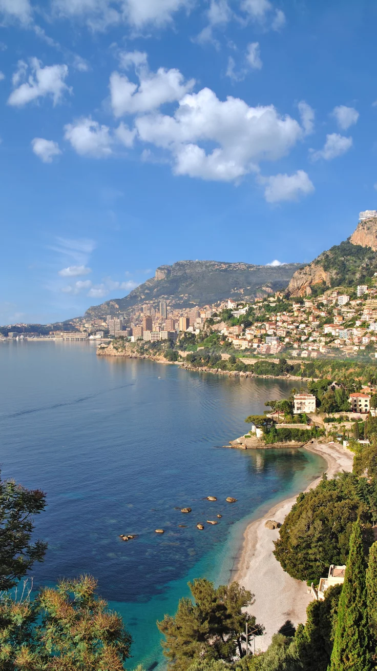 This contains: elevated view of the Mediterranean sea and coastline of cannes france in the french riviera
