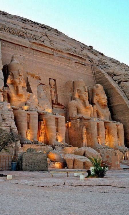 This may contain: the large statues are all lit up at night