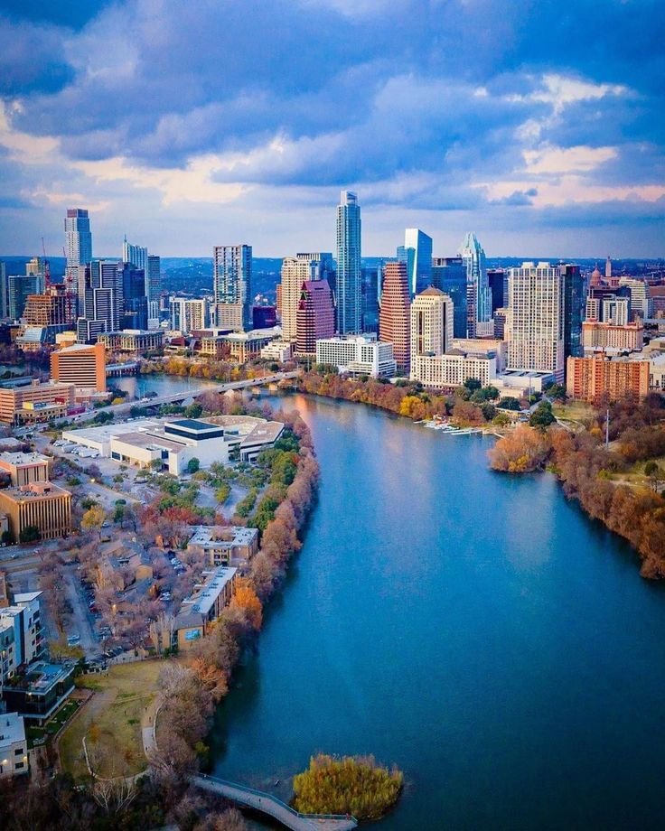 This may contain: an aerial view of the city skyline and river