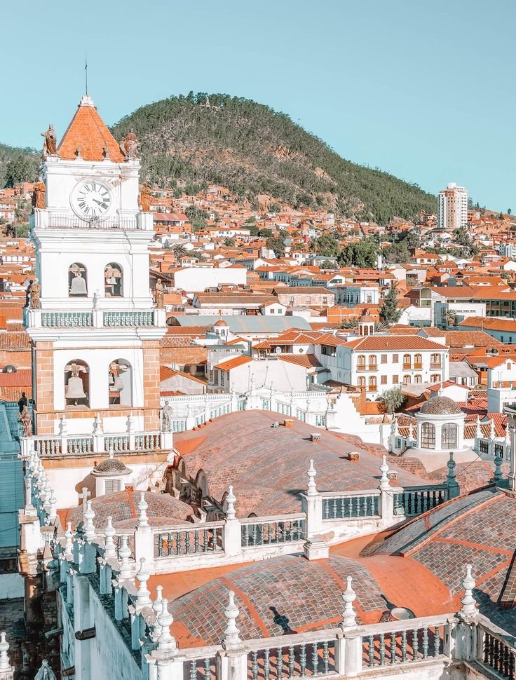 This may contain: an aerial view of a city with buildings and a clock tower