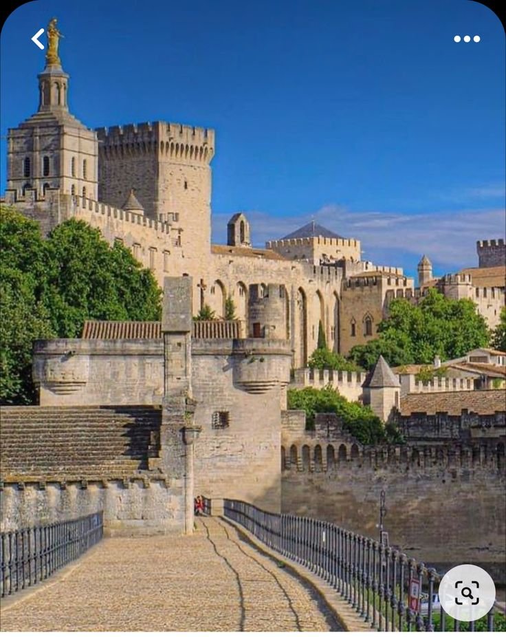 This may contain: an image of a castle that looks like it is built on top of a hill