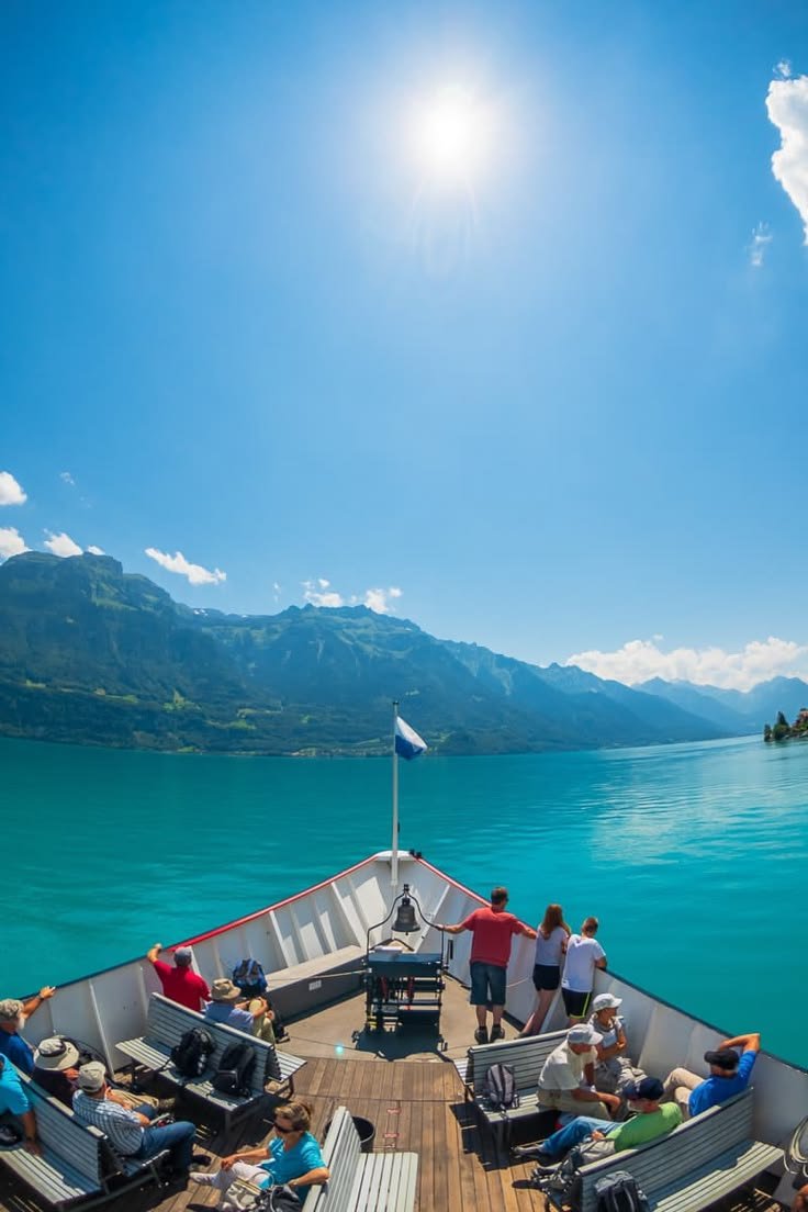 This may contain: people are sitting on the back of a boat