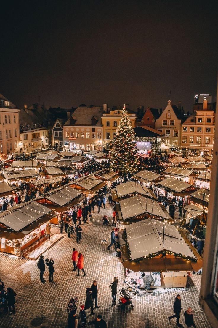 This may contain: an aerial view of a christmas market at night