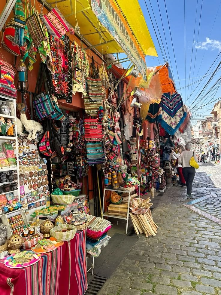 This may contain: an outdoor market with many items for sale