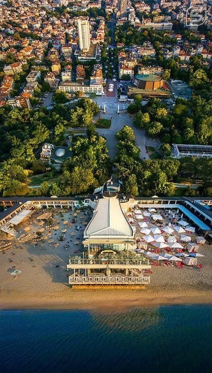 This may contain: an aerial view of the beach and city