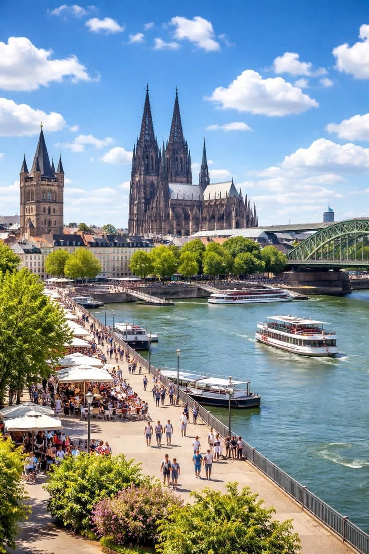 This may contain: people are walking along the river in front of an old building with spires on it