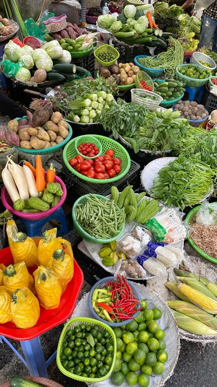 This may contain: many different types of fruits and vegetables on display