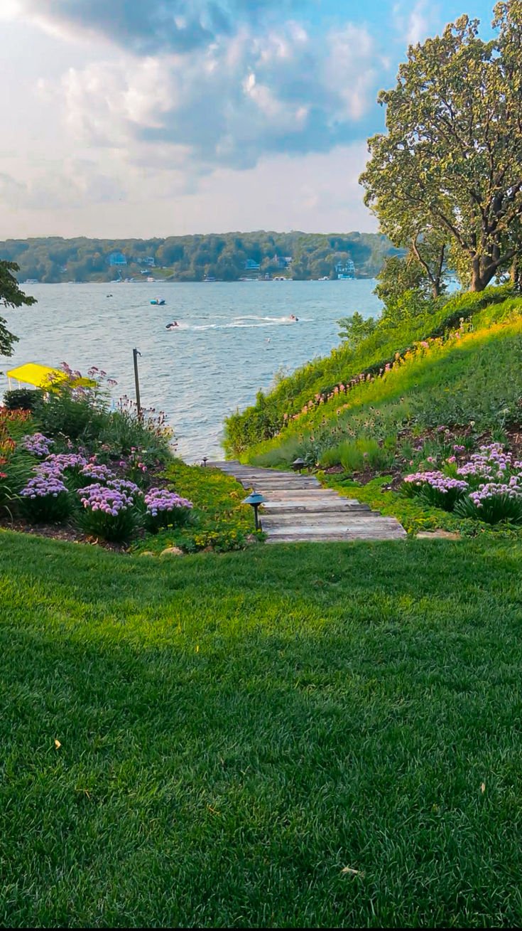 This may contain: there is a path going up to the water