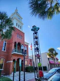 This may contain: a tall clock tower sitting next to a red brick building