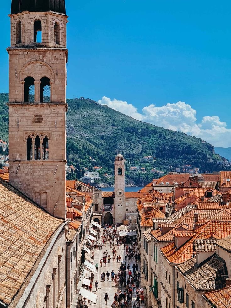 This may contain: an aerial view of people walking around in the old town