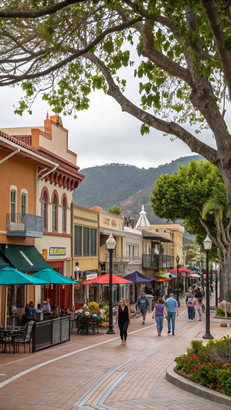 This contains: San Luis Obispo downtown street view with tourists enjoying free outdoor activities