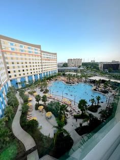 This may contain: an aerial view of a hotel and swimming pool
