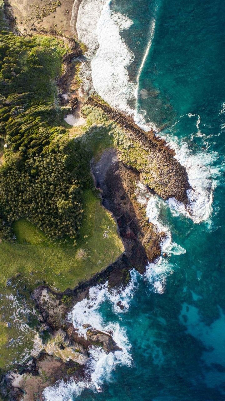 This may contain: an aerial view of the ocean and land