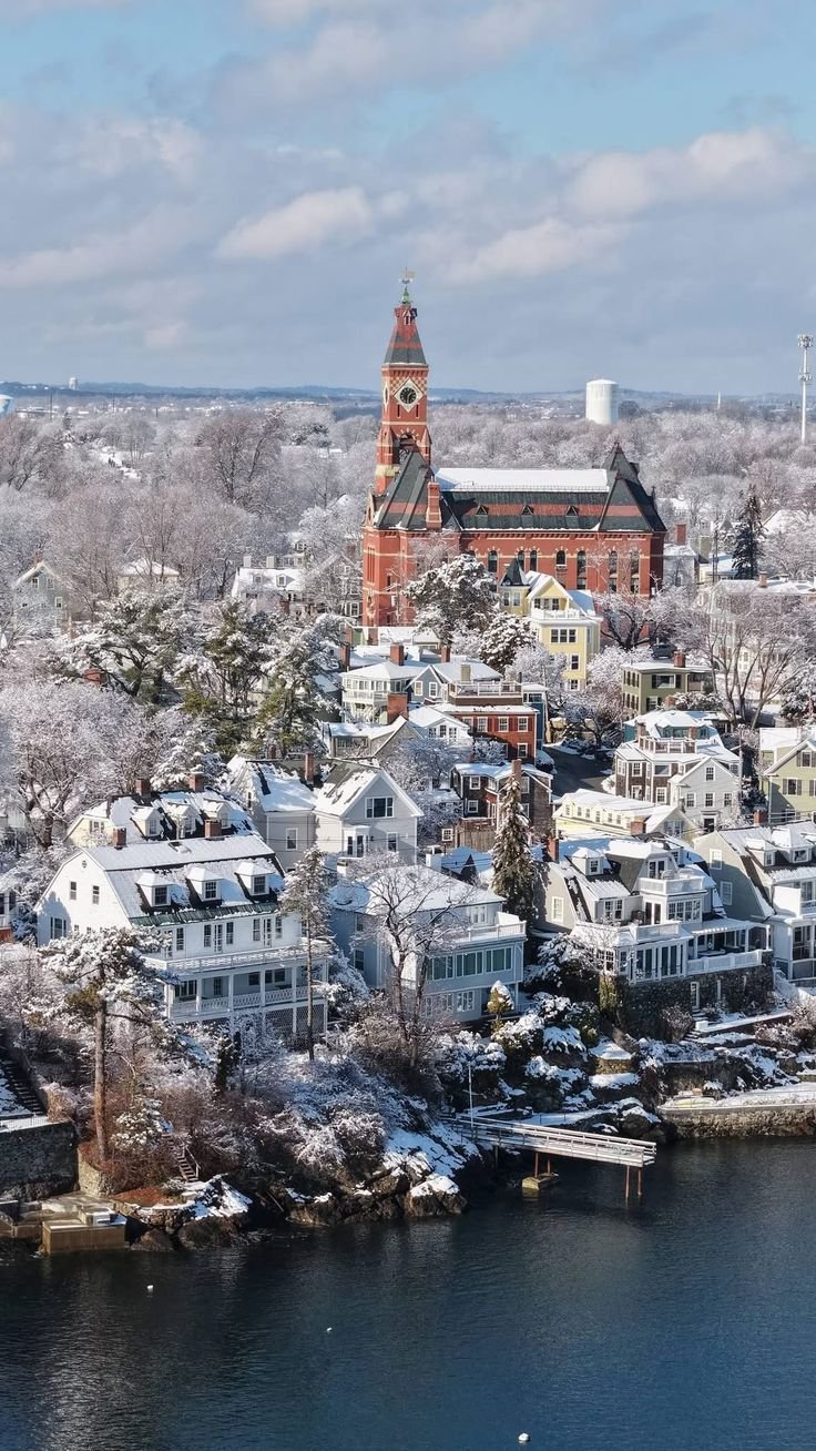 This may contain: an aerial view of a city with lots of snow on the ground