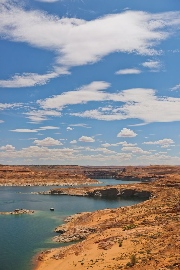 This may contain: a large body of water sitting in the middle of a desert