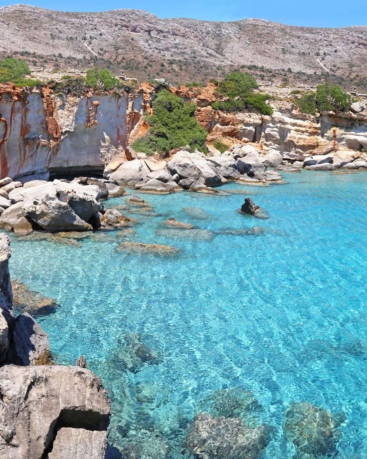 This may contain: the water is crystal clear and blue