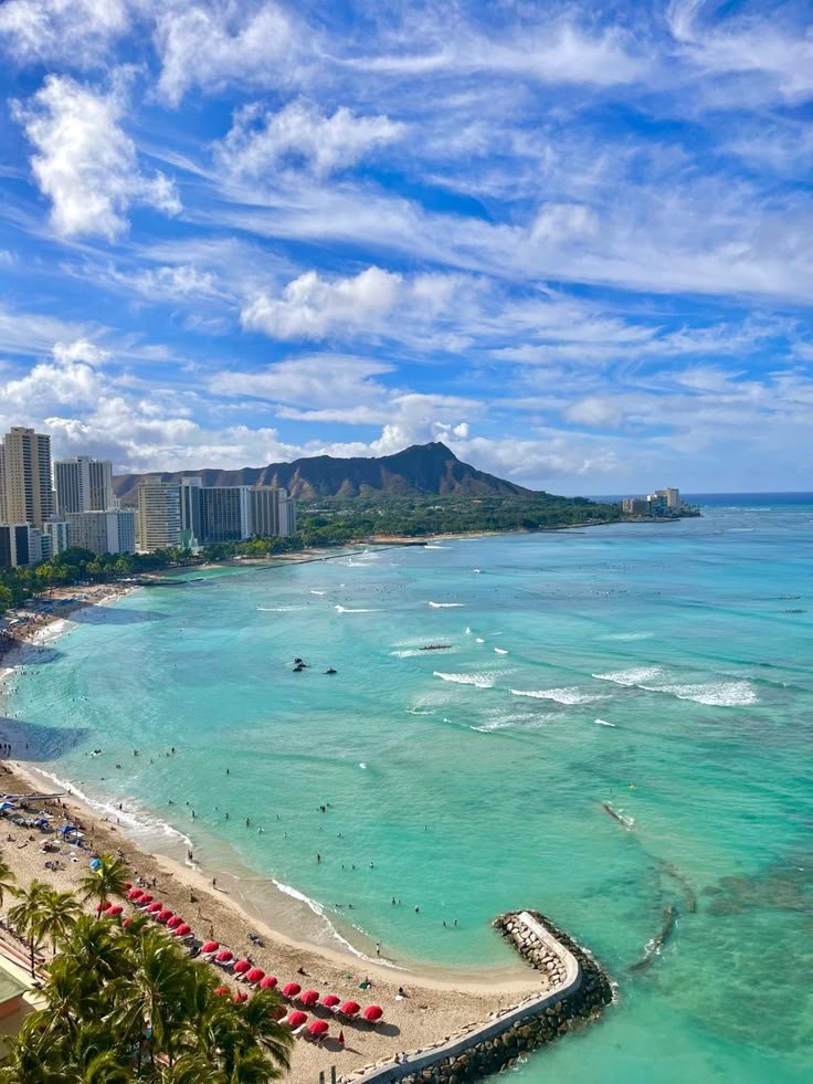 This may contain: an aerial view of the beach and ocean in waikiki, oahua
