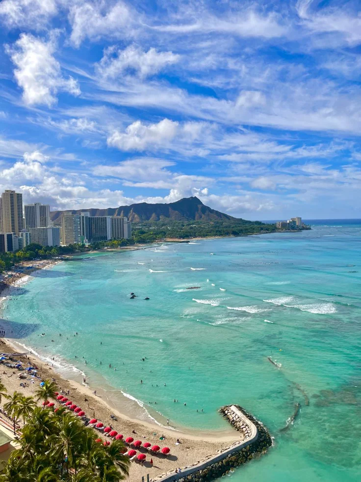 This may contain: an aerial view of the beach and ocean in waikiki, oahua