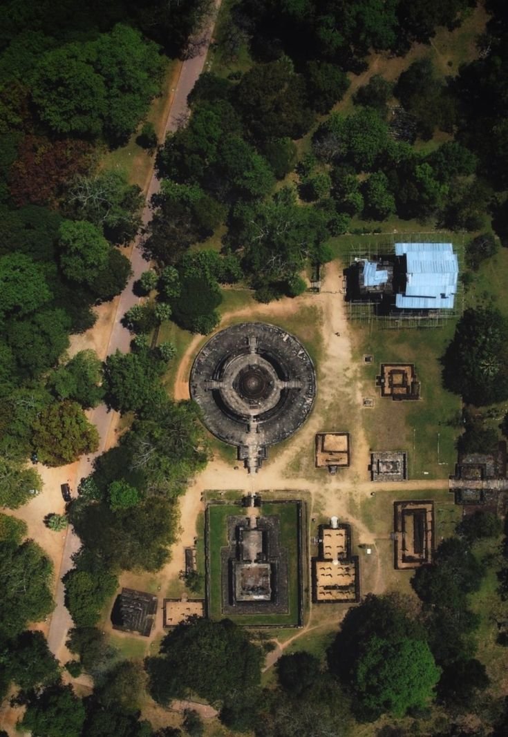 This may contain: an aerial view of the ruins and surrounding trees