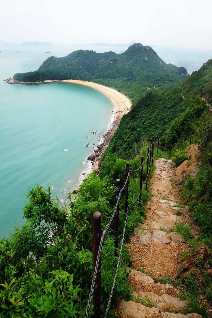 This may contain: stairs lead down to the beach and ocean
