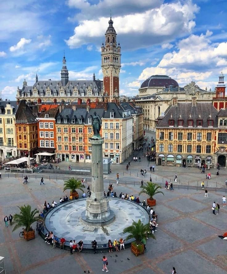 This may contain: a city square with many people walking around it