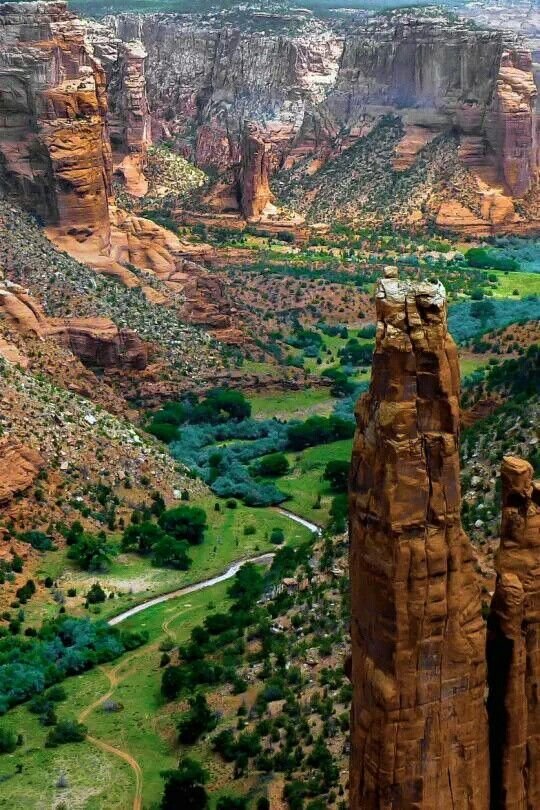 This may contain: an aerial view of canyons and mountains in the desert