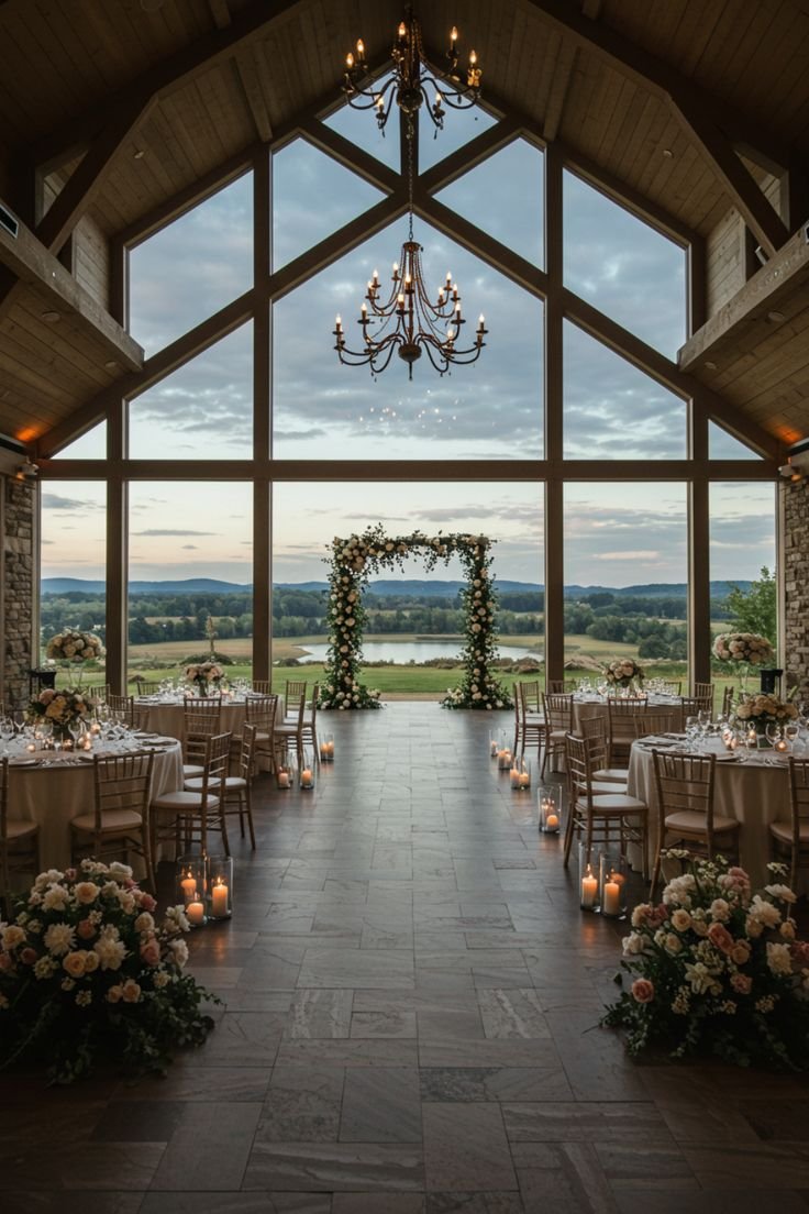 This may contain: an indoor wedding venue with chandeliers and tables