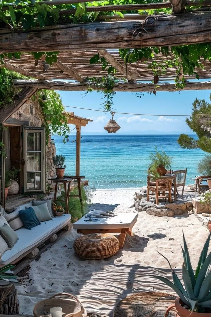 This may contain: an outdoor seating area on the beach