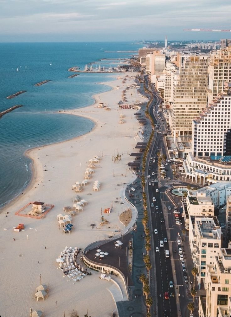 This may contain: an aerial view of the beach and city