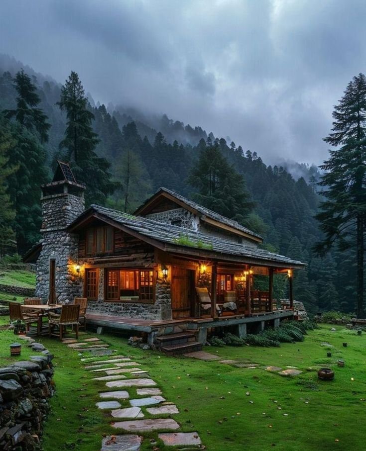This may contain: a small cabin in the middle of a field with stone steps leading up to it