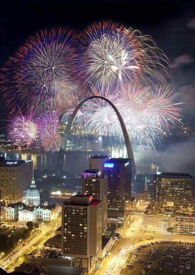 This may contain: fireworks light up the night sky in st louis, missouri on new year's eve