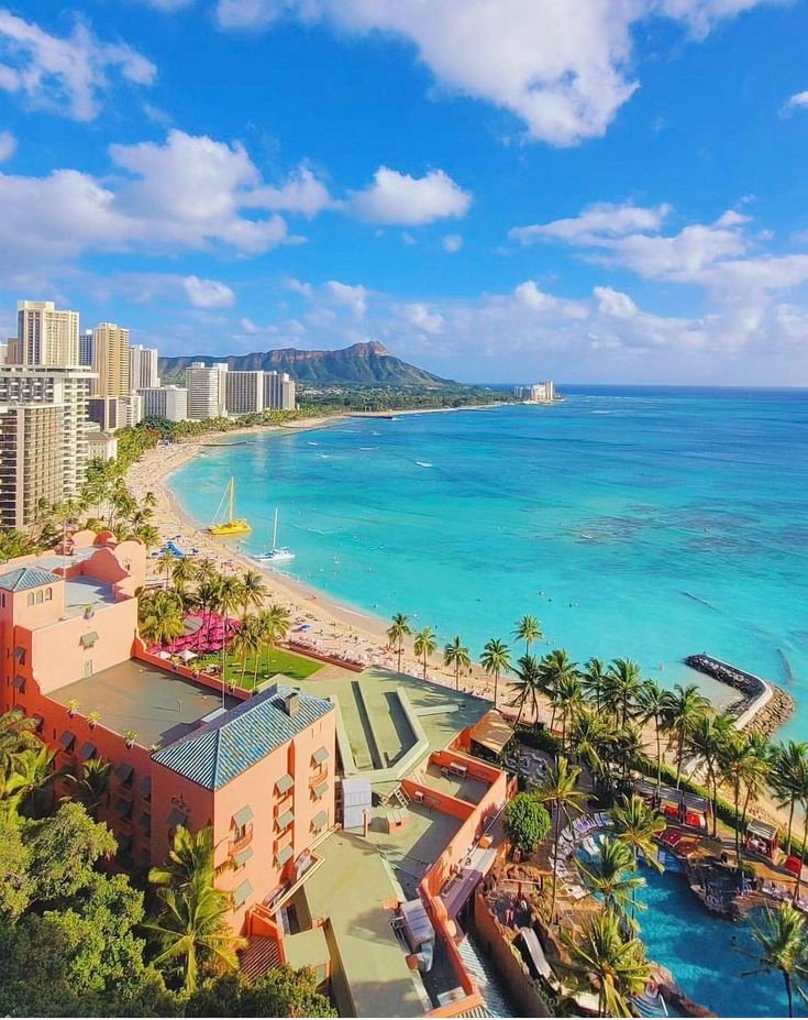 This may contain: an aerial view of the beach and ocean in waikiki, oahua