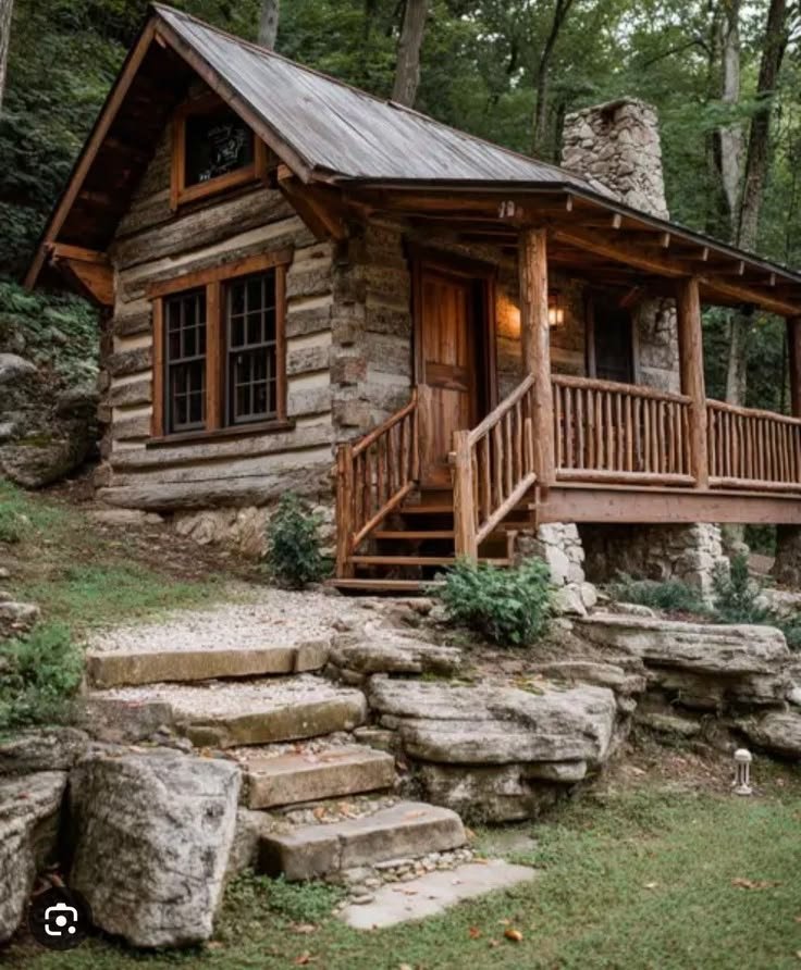 This may contain: a log cabin with steps leading up to it